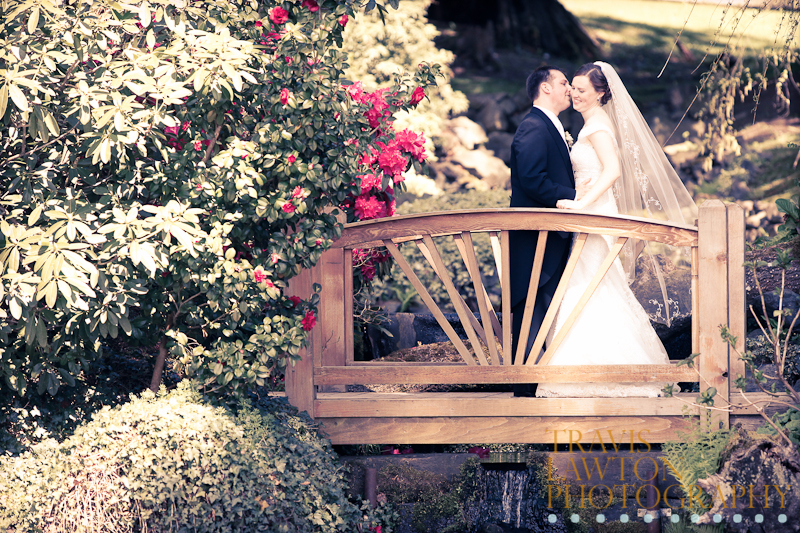 Another image of the bride and groom on the bridge on the property