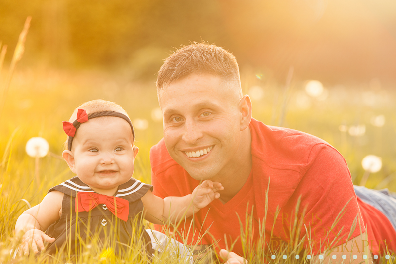 Smiley Baby and Daddy in a golden grass field