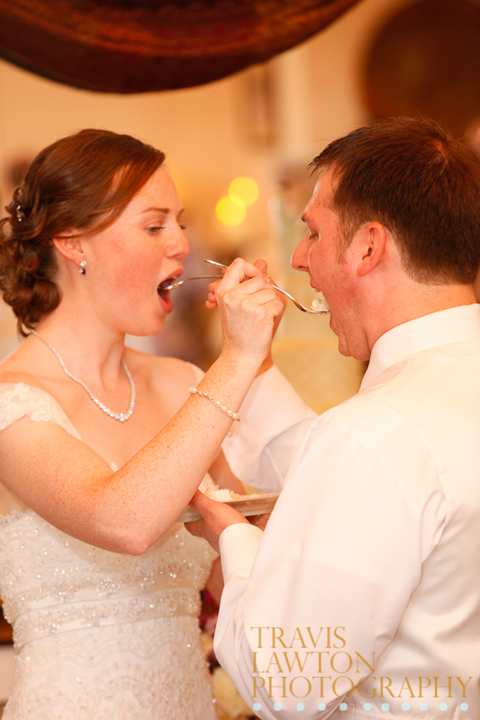 Bride and Groom sharing cake