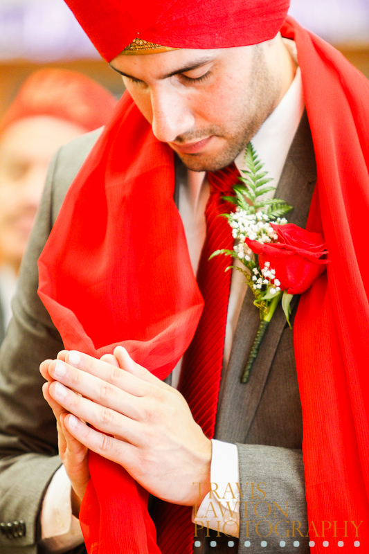 Indian Groom hold hands together while praying during his wedding